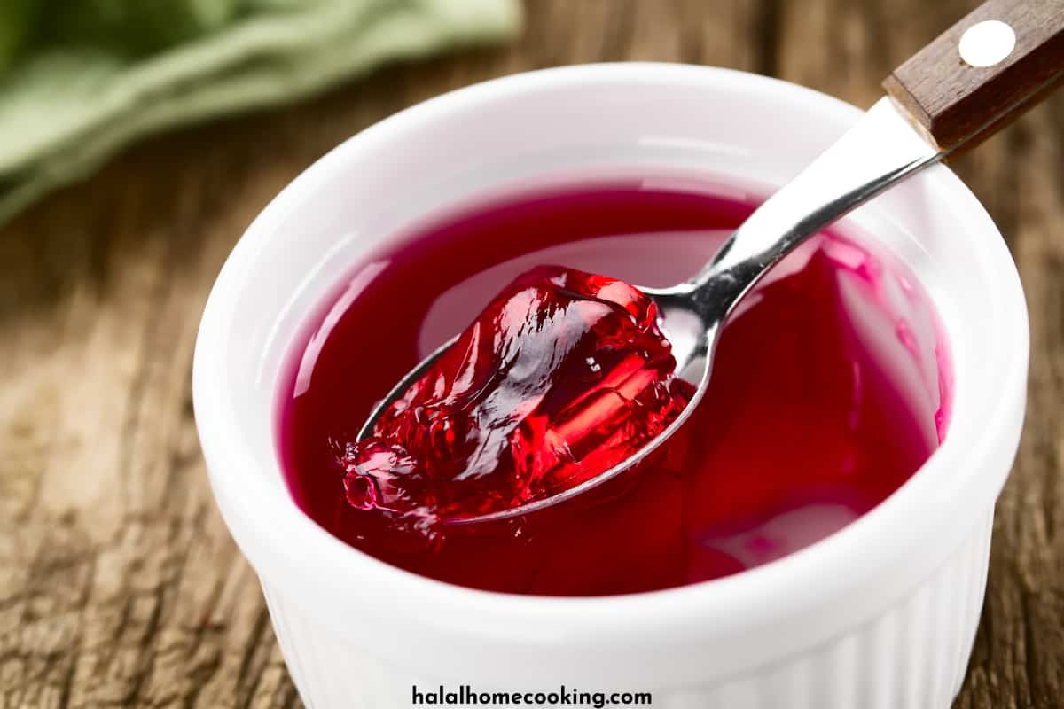 red-gelatin-in-a-spoon-and-a-white-cup